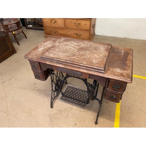 194 - Singer sewing machine table with integrated sewing machine on Iron base with original Singer manual ... 