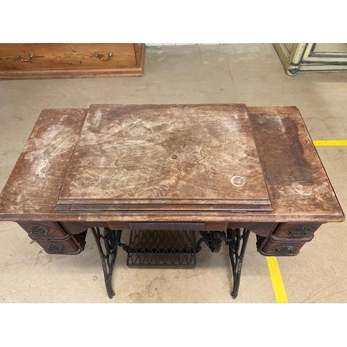 194 - Singer sewing machine table with integrated sewing machine on Iron base with original Singer manual ... 