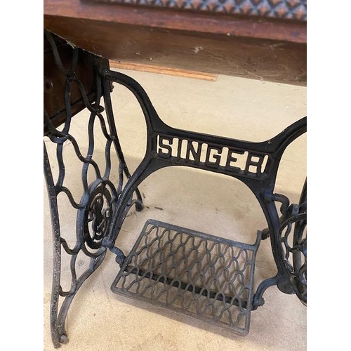 194 - Singer sewing machine table with integrated sewing machine on Iron base with original Singer manual ... 