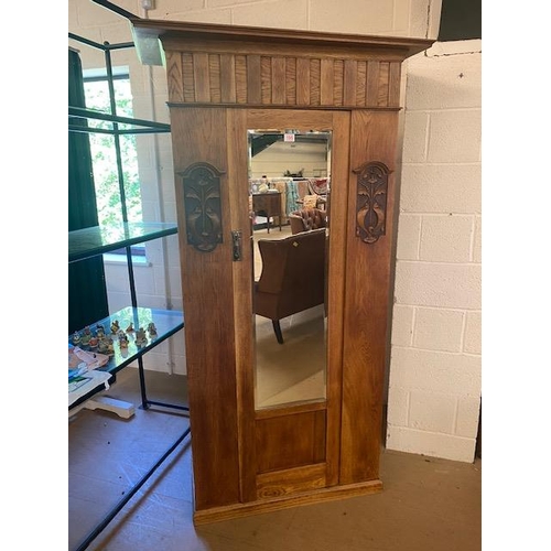 195 - Single wardrobe with door containing bevel edged mirror, carved art deco detailing and original key,... 