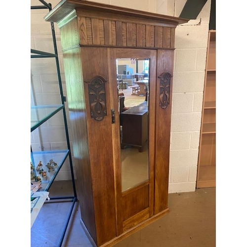 195 - Single wardrobe with door containing bevel edged mirror, carved art deco detailing and original key,... 