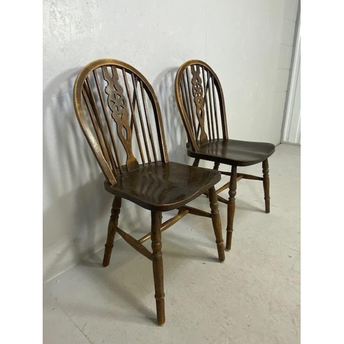 198 - Pair of wheel back chairs