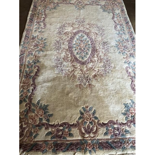 231 - Chinese  style wool rug of flowers on a cream back ground approximately 275 x 170