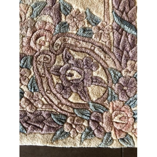 231 - Chinese  style wool rug of flowers on a cream back ground approximately 275 x 170