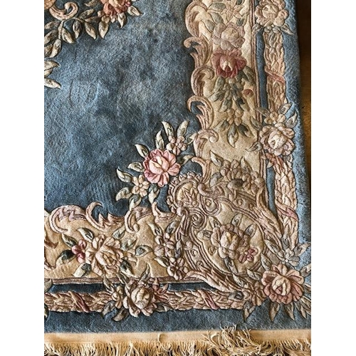 232 - Chinese style wool rug of flower design approximately 275 x 180cm