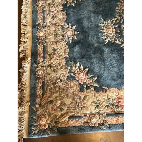 232 - Chinese style wool rug of flower design approximately 275 x 180cm