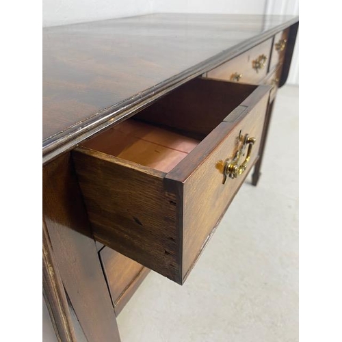 235 - Antique furniture, mahogany side table with 4 drawers and a central cutlery drawer, drop flaps to ea... 