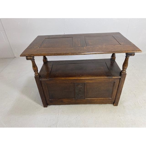 237 - Oak monks bench with sliding table top initials SS carved to back and front approximately 94 x 50 x ... 