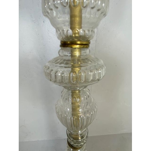 249 - Standard lamp base of fluted glass sections supported by 3 Iron scroll legs