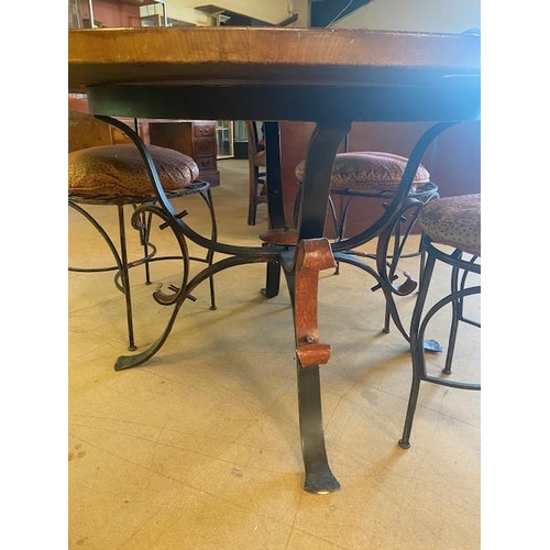 251 - late 20th century arts and crafts style round oak top dining table on wrought iron scroll legs with ... 