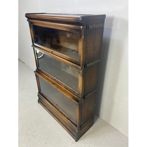 253 - Globe Wernicke three section graduated , glazed oak book case, Wernicke trade label in top section, ... 