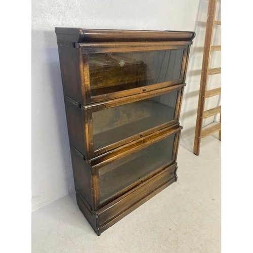 253 - Globe Wernicke three section graduated , glazed oak book case, Wernicke trade label in top section, ... 