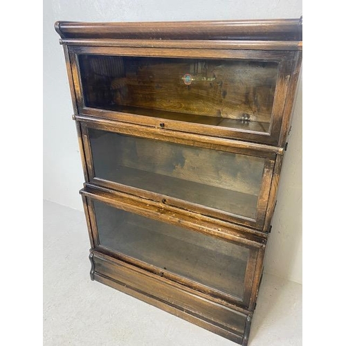 253 - Globe Wernicke three section graduated , glazed oak book case, Wernicke trade label in top section, ... 