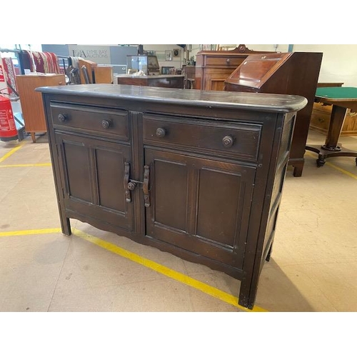 254 - Ercol mid 20th century dark elm dresser, two cupboards with two drawers above approximately 120 x 48... 