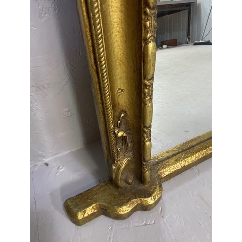 261 - Reproduction 19th century style  half round overmantel mirror,in a gilt finish frame approximately 1... 