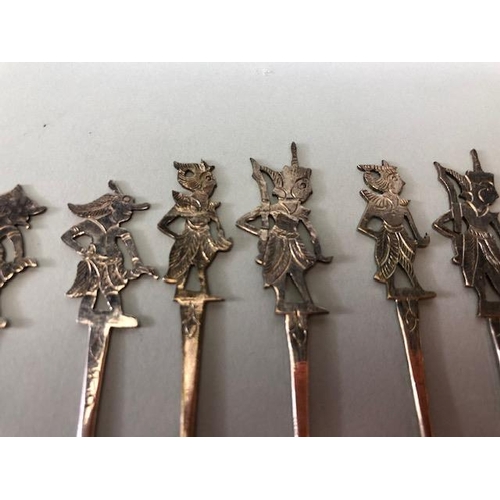 27 - Collection of unmarked silver cocktail sticks depicting Garuda, set of twelve