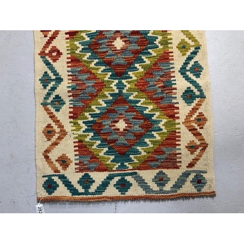 274 - Oriental hand knotted wool rug  with geometric designs approximately 145 x 61 cm