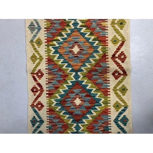 274 - Oriental hand knotted wool rug  with geometric designs approximately 145 x 61 cm