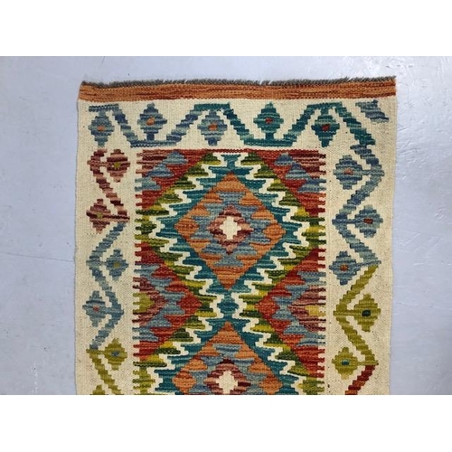 274 - Oriental hand knotted wool rug  with geometric designs approximately 145 x 61 cm