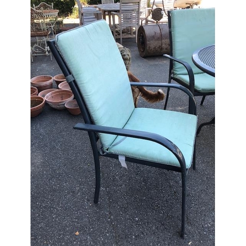 277 - Metal garden table and six chairs with cushions