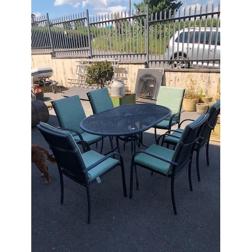 277 - Metal garden table and six chairs with cushions