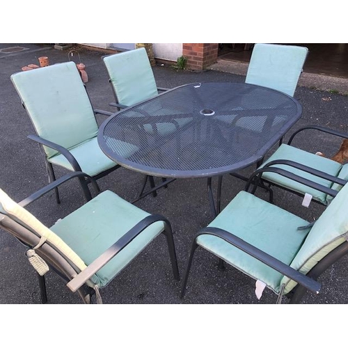 277 - Metal garden table and six chairs with cushions