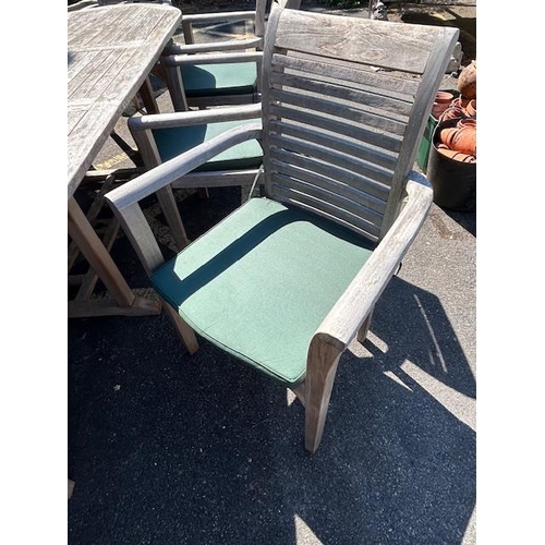 280 - Large Teak Garden table approx 2m x 1m with eight Garden chairs plus cushions