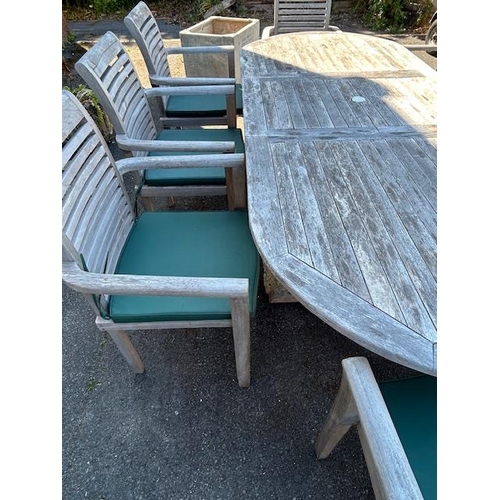 280 - Large Teak Garden table approx 2m x 1m with eight Garden chairs plus cushions