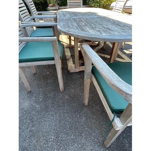 280 - Large Teak Garden table approx 2m x 1m with eight Garden chairs plus cushions