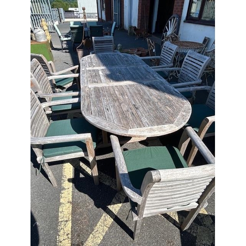 280 - Large Teak Garden table approx 2m x 1m with eight Garden chairs plus cushions