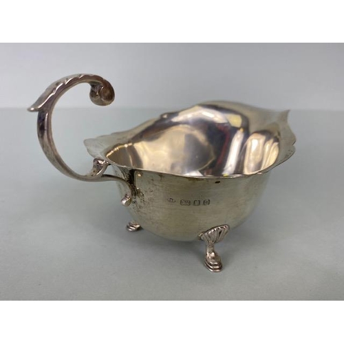 29 - English London  Silver hallmarked  sauce boat on three hoof feet approximately 97g