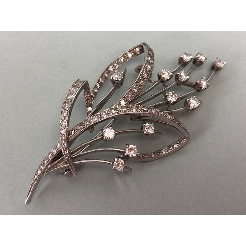 45 - White Gold contemporary styled Floral Spray brooch with Diamonds, Thirteen single set Diamonds in fo... 