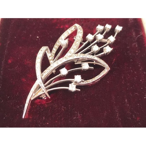 45 - White Gold contemporary styled Floral Spray brooch with Diamonds, Thirteen single set Diamonds in fo... 