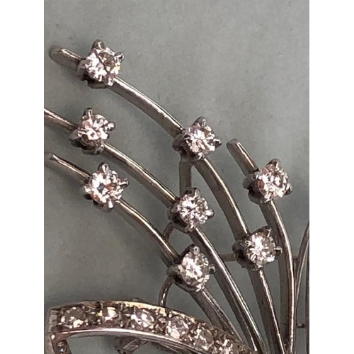 45 - White Gold contemporary styled Floral Spray brooch with Diamonds, Thirteen single set Diamonds in fo... 