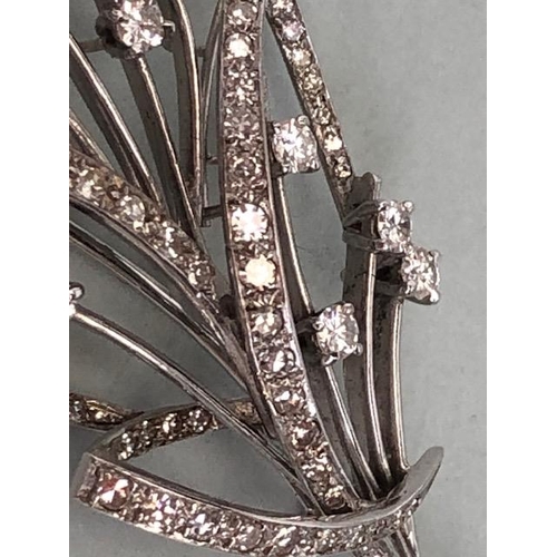 45 - White Gold contemporary styled Floral Spray brooch with Diamonds, Thirteen single set Diamonds in fo... 