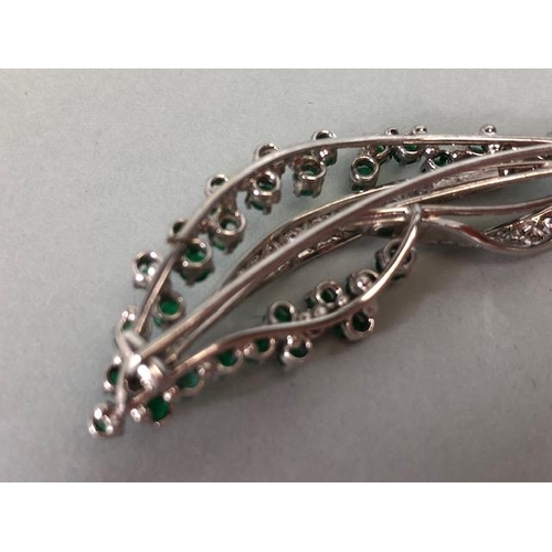 46 - 18ct White Gold twist Spray Brooch set with round brilliant cut diamonds and round cut Emeralds (pro... 