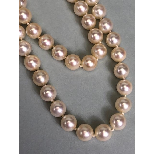 47 - Cultured Pearls double strand joined by an ornate white metal clasp set with gemstones including Dia... 