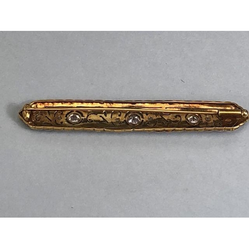 64 - Antique continental  unmarked yellow and white metal bar brooch of scroll nouveau design set with 3 ... 