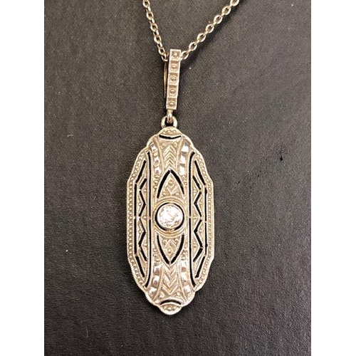 65 - Antique continental yellow and white metal pendant of nouveau scroll design with central round cut d... 