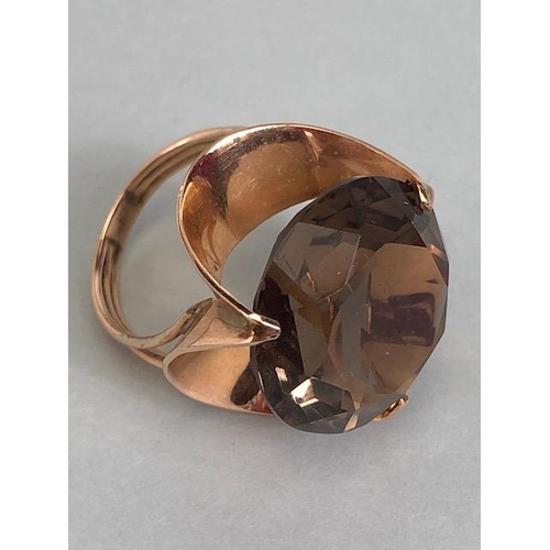 67 - 14kt stamped continental rose gold ring, set with a large round  smoky quartz approximately 10.3g to... 