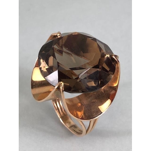 67 - 14kt stamped continental rose gold ring, set with a large round  smoky quartz approximately 10.3g to... 