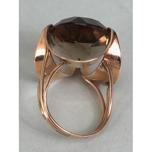 67 - 14kt stamped continental rose gold ring, set with a large round  smoky quartz approximately 10.3g to... 