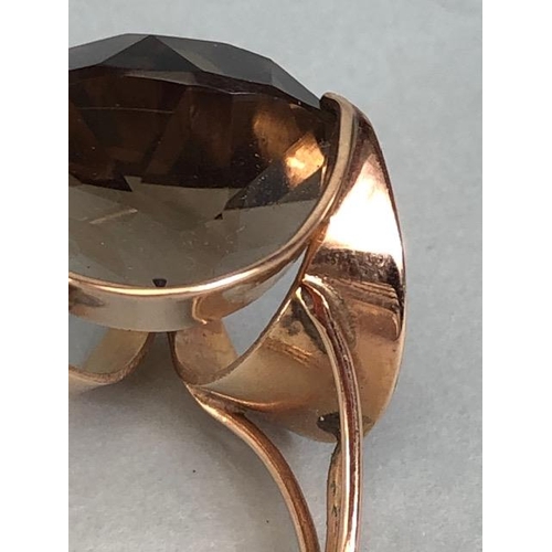 67 - 14kt stamped continental rose gold ring, set with a large round  smoky quartz approximately 10.3g to... 