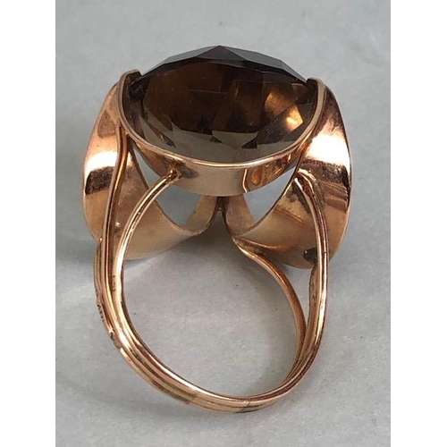 67 - 14kt stamped continental rose gold ring, set with a large round  smoky quartz approximately 10.3g to... 