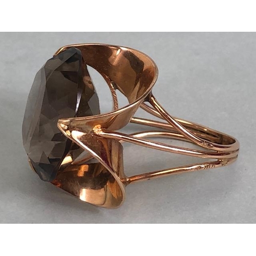 67 - 14kt stamped continental rose gold ring, set with a large round  smoky quartz approximately 10.3g to... 