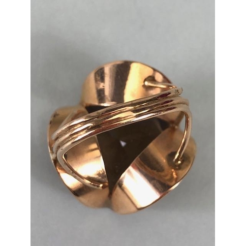 67 - 14kt stamped continental rose gold ring, set with a large round  smoky quartz approximately 10.3g to... 