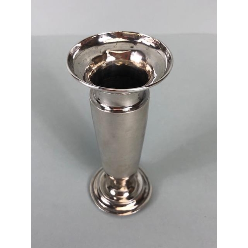 72 - Silver weighted posy or stem vase on circular stepped base engraved with the letter M approx 11cm ta... 