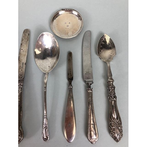 8 - Collection of assorted silver items to include butter knives, spoons etc