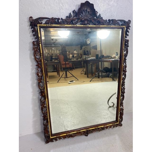 82 - Large Ornate mirror with carved open work frame and shell design crest, gold gilt inner frame and be... 