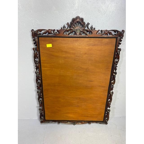 82 - Large Ornate mirror with carved open work frame and shell design crest, gold gilt inner frame and be... 